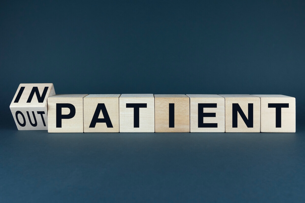 A conceptual image representing the divide between inpatient and outpatient care